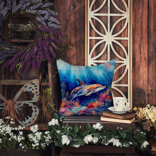 An indoor arrangement with a dolphin-themed pillow, a teacup on books, flowers, and rustic wooden elements.