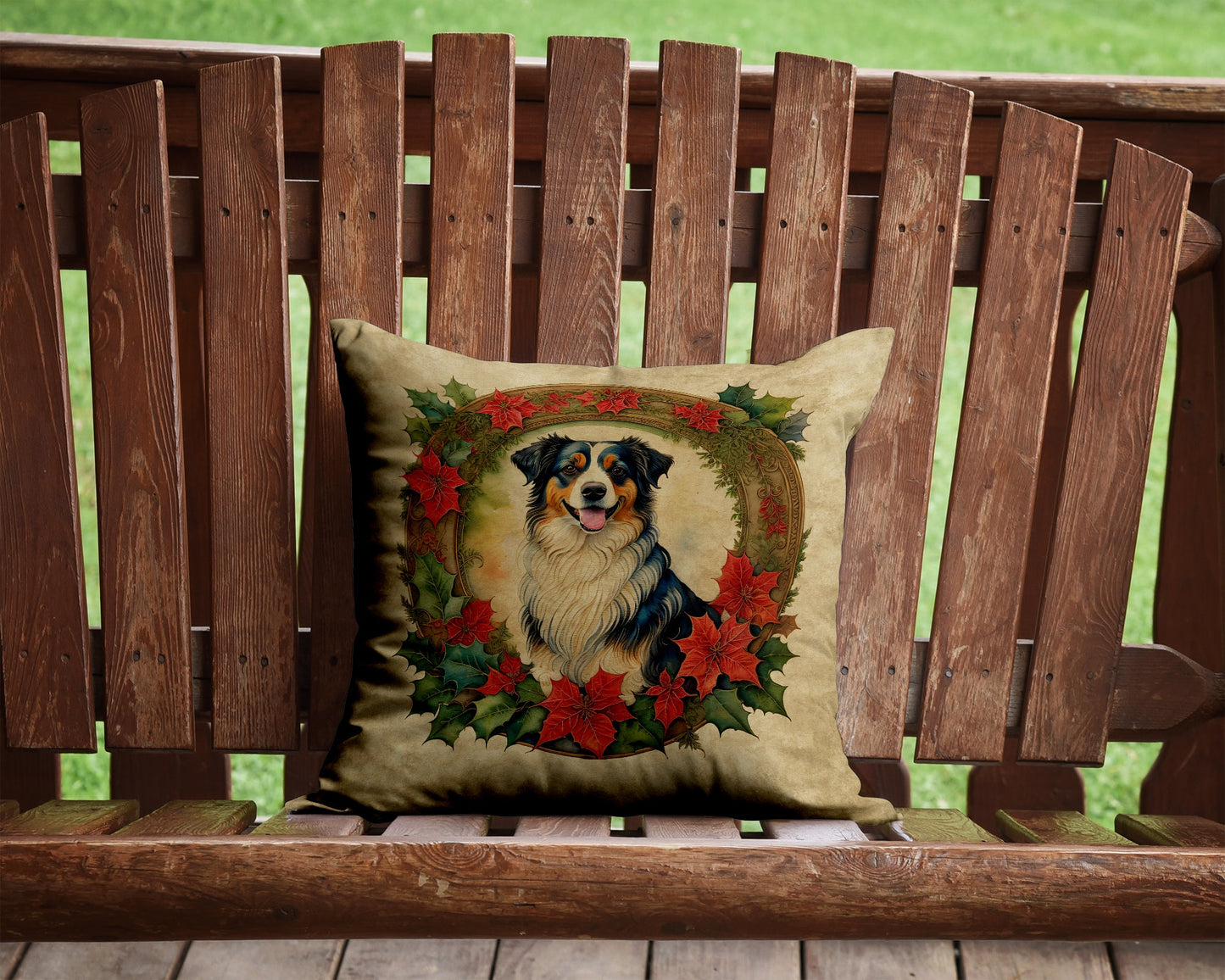 A square cushion on a wooden chair swing features a painting of a dog surrounded by holly and poinsettias.
