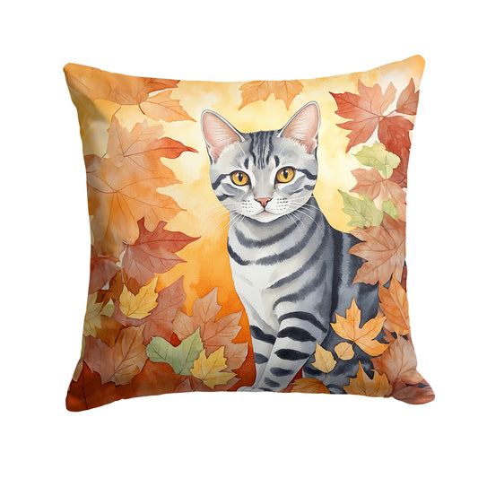 Square throw pillow with a watercolor painting of a grey tabby cat surrounded by autumn leaves.
